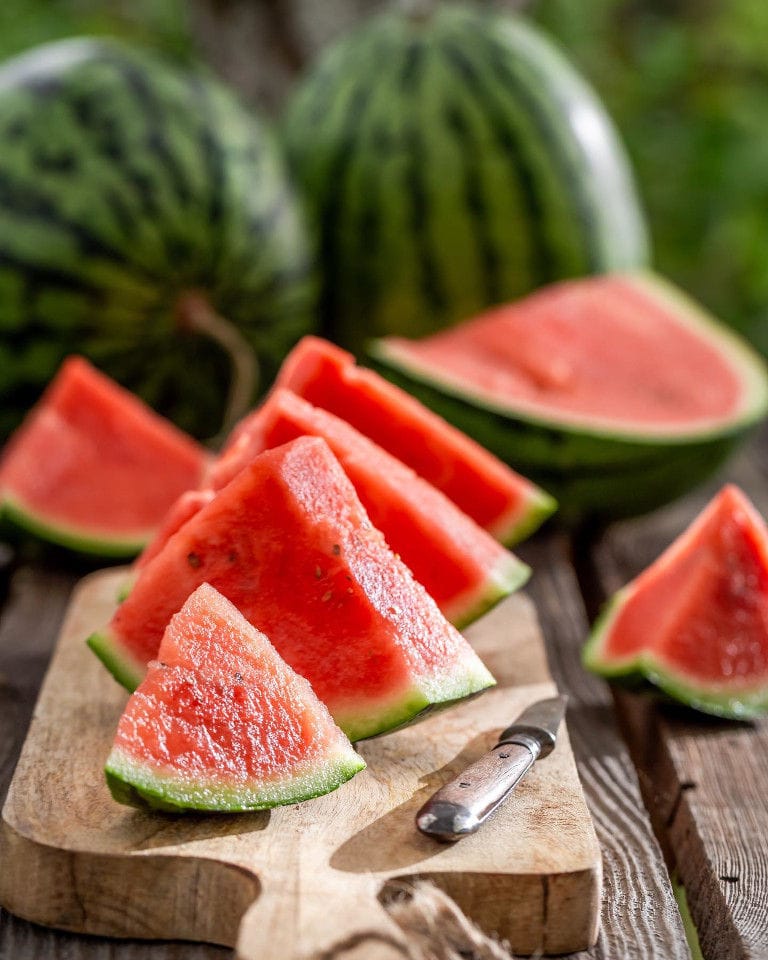 pieces of watermelon from 'Ktima Golemi' and a knife on the wood plateau